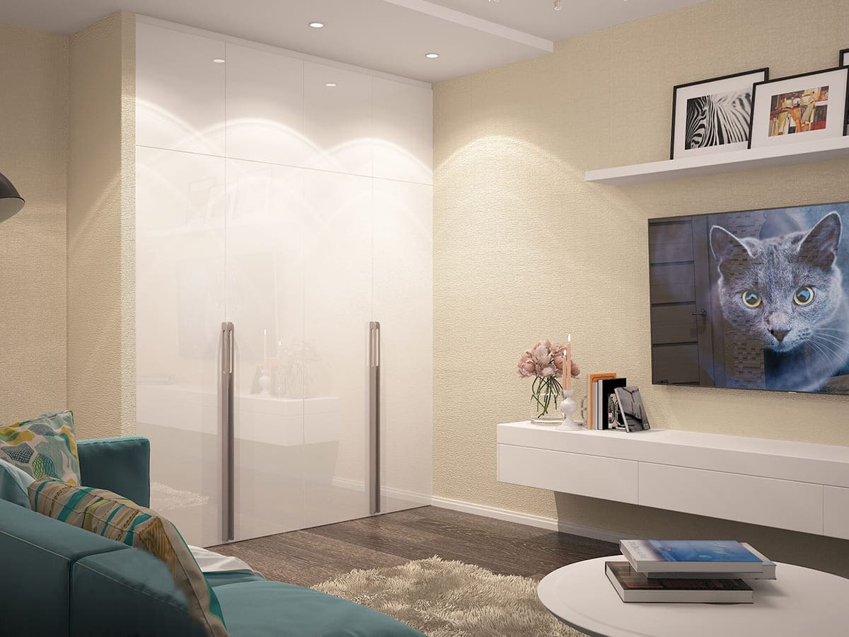 Современный дизайн интерьера гостиной с большим белым шкафом, кофейным столиком и мягким освещением &mdash; светлая стильная комната