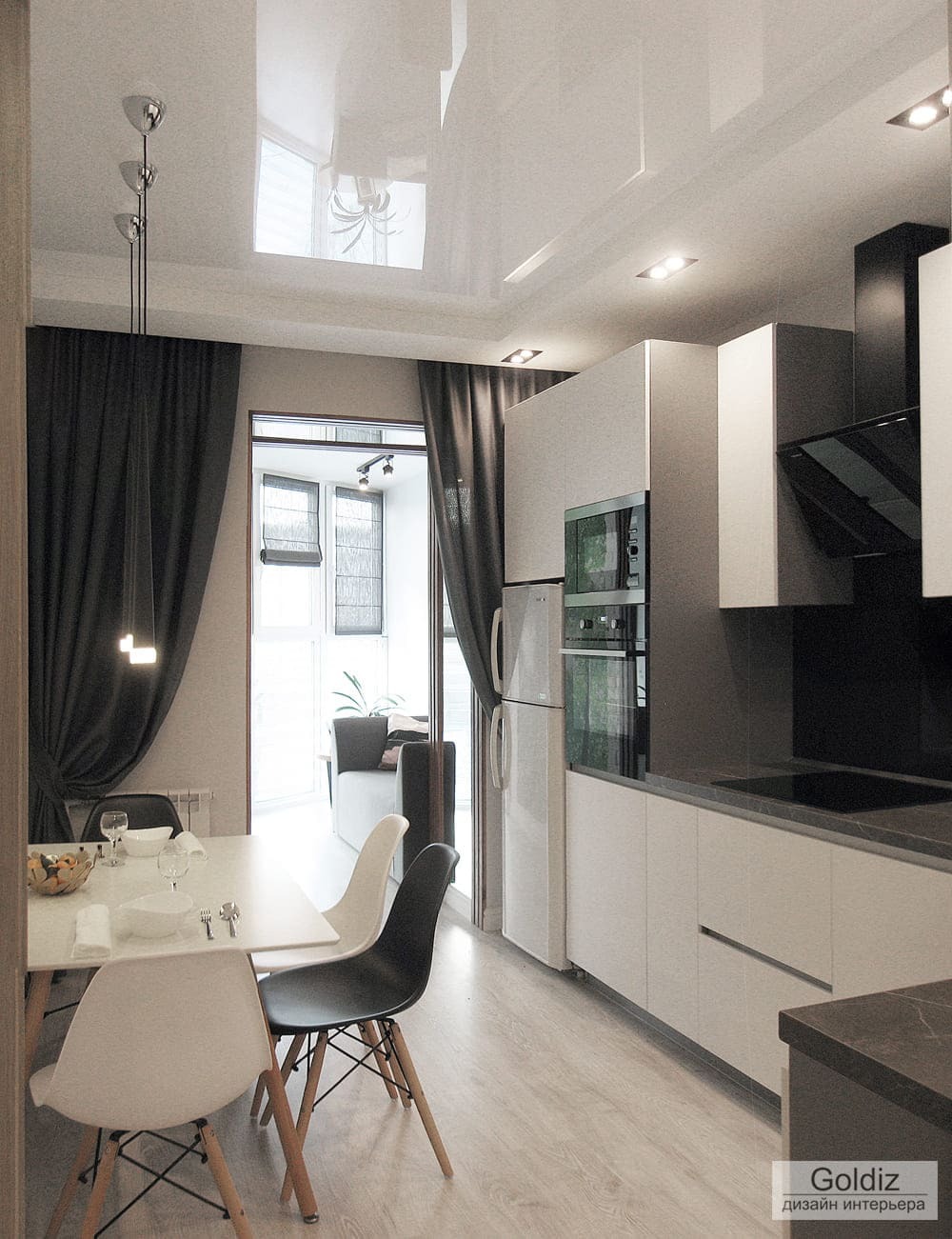 Столовая зона с подвесным освещением, матовыми фасадами кухни и глубокими шторами для зонирования пространства