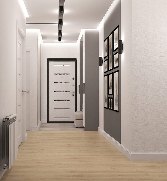 Просторный минималистичный коридор с яркими светильниками и нейтральными оттенками.